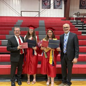 Pictured from left to right, Bunker Hill Superintendent Todd Dugan, Vivien Wilcox, Grace Burris, and Lewis and Clark Community College President Ken Trzaska. The group poses for a photo the night of Bunker Hill High School’s 2026 Graduation Ceremony. (Photo provided by LC Marketing & PR)