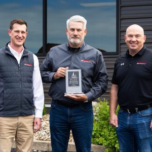 Shown from left are Kyle Runge (Vice President), Rob Johnes (CEO), and Kyle Ogden (President) of Helmkamp Construction Co.