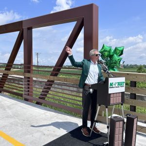 SJ Morrison, managing director of MCT, speaks at the ribbon cutting ceremony. 
